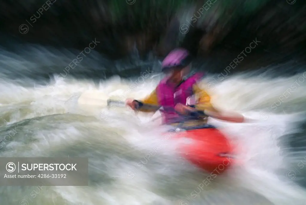Kayaker paddling in spring runoff (abstract), Rocky Mtns, CO