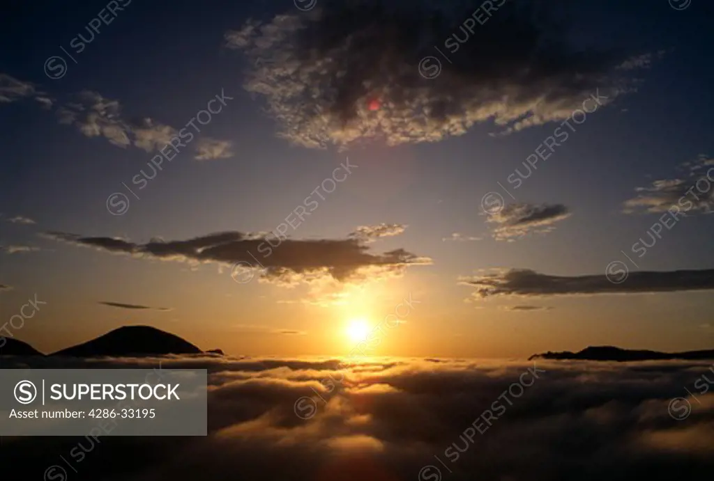 Sunrise sky above morning clouds and mountains, Rocky Mtn Nat'l Park, CO
