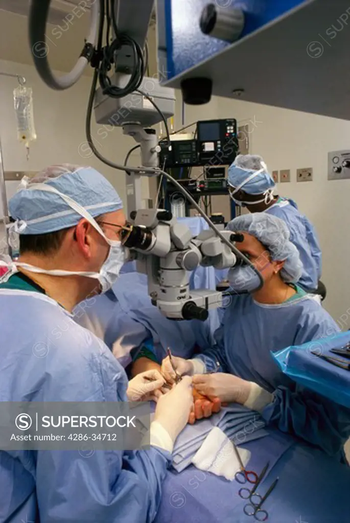 Operating room using double microscope for micro surgery.  Extensive hospital coverage.