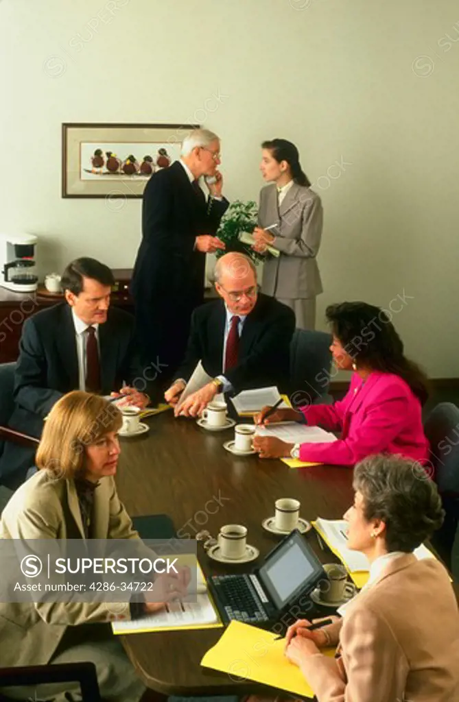 Executives meeting in conference room