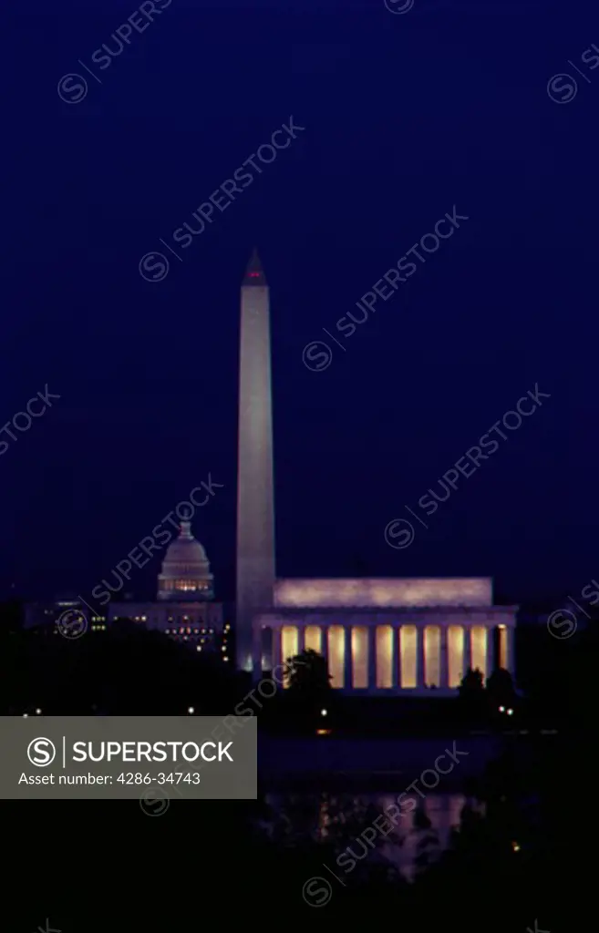 Night view of U.S. Capitol, Washington Monument and Lincoln Memorial.
