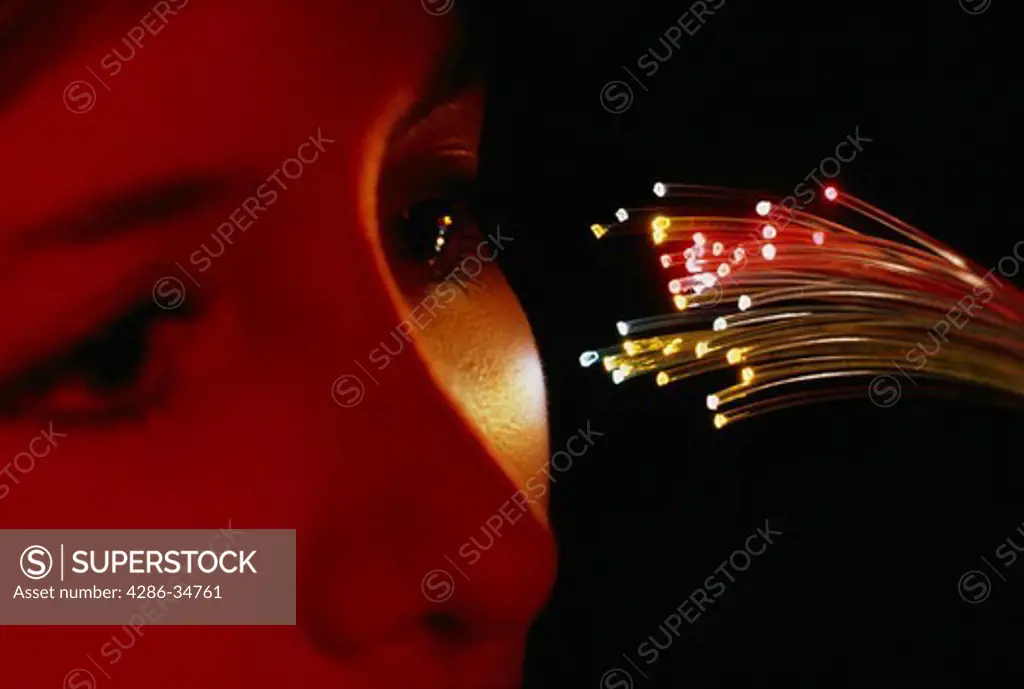 Fiber optics light woman's face.  (model released)