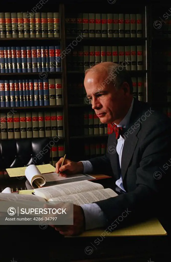 Lawyer at work in legal library