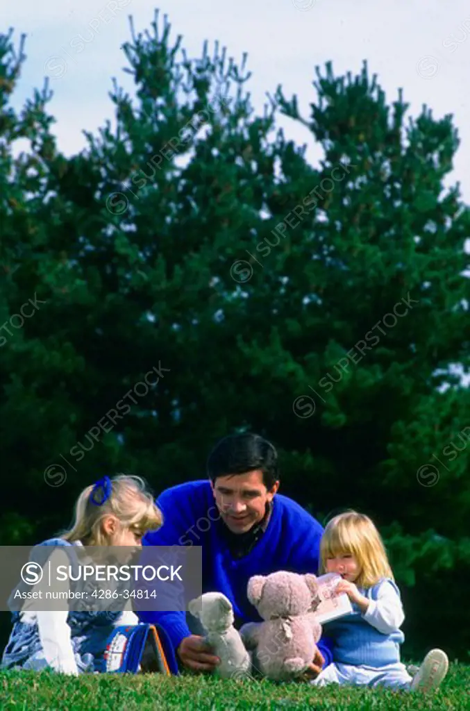 Father and daughters in Maryland park.  Also have horizontal shot with mother in the picture.  See JHP1315.