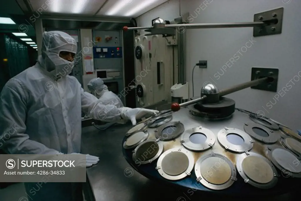 Computer chips coming out of oven in cleanroom in Virginia manufacturing facility.