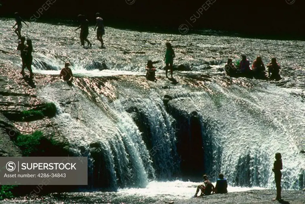 People swimming at South Umpqua falls in Oregon