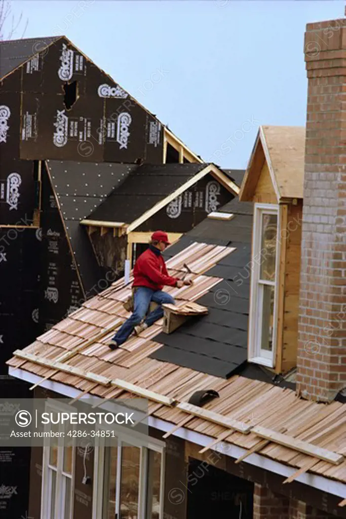 Harry Walters putting roof on new home in Montgomery County, Maryland