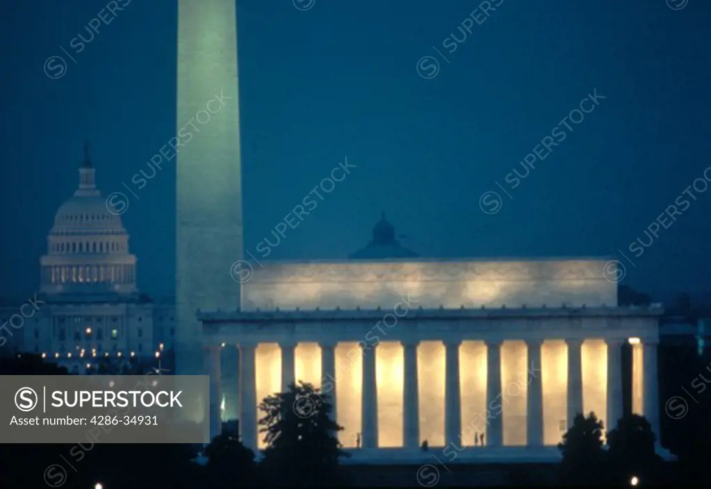 Lincoln Memorial, Washington Monument, and U.S. Capitol at night.