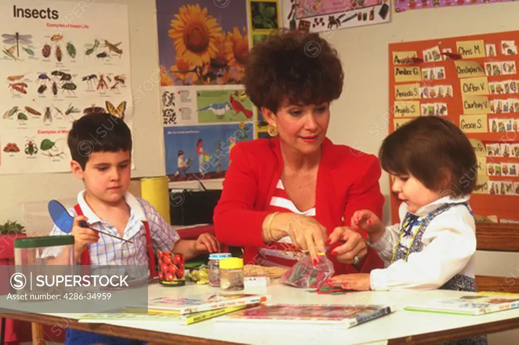 Teacher and child, hands-on science lesson at day care.  (model released)