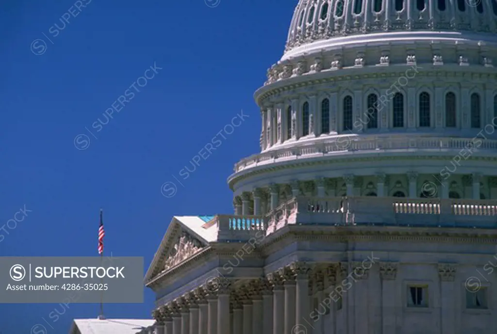 U.S. Capitol dome and flag in Washington, DC. - CF18345