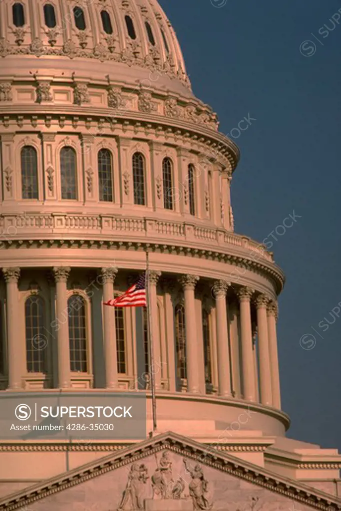 U.S. Capitol dome with flag in Washington, DC. - CF58719