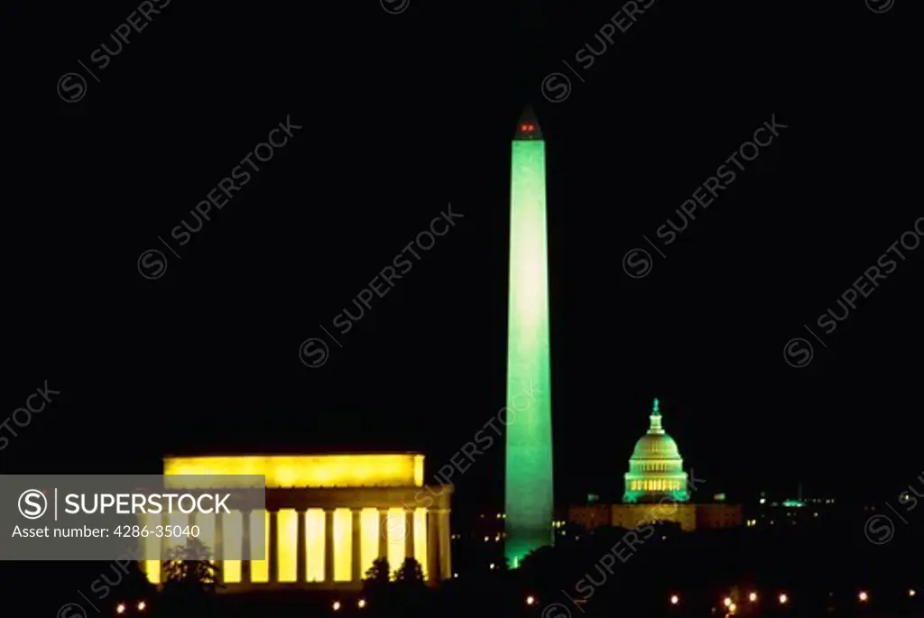 Three monuments in line at night -- Lincoln Memorial, Washington Monument and the U.S. Capitol. - DA11255