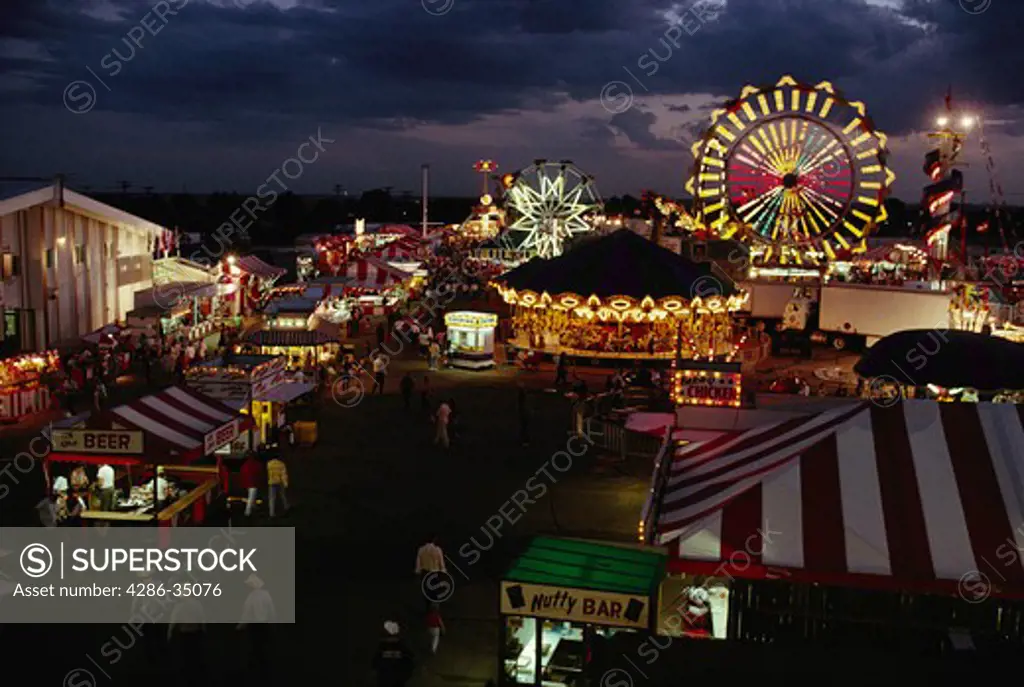 Carnival rides at twilight at Cheyenne Frontier Days in Cheyenne, WY. - CF65698