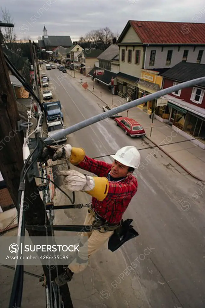 Lineman working on power lines in St. Michaels, Maryland. - AA07311