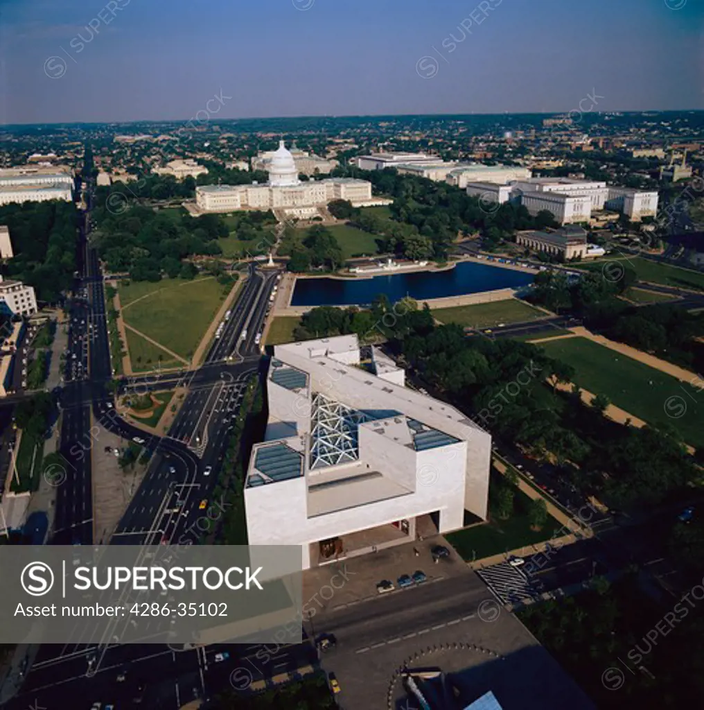 Aerial view of the East Wing of the National Gallery of Art in the foreground and the U.S. Capitol in the background. - AA11450