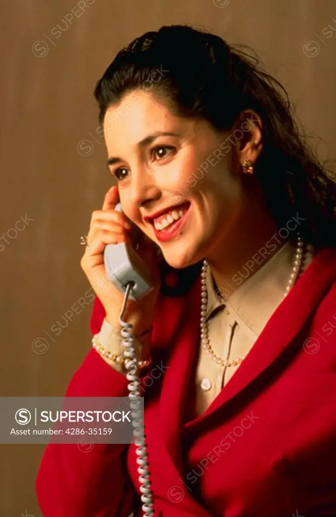Portrait of businesswoman using telephone