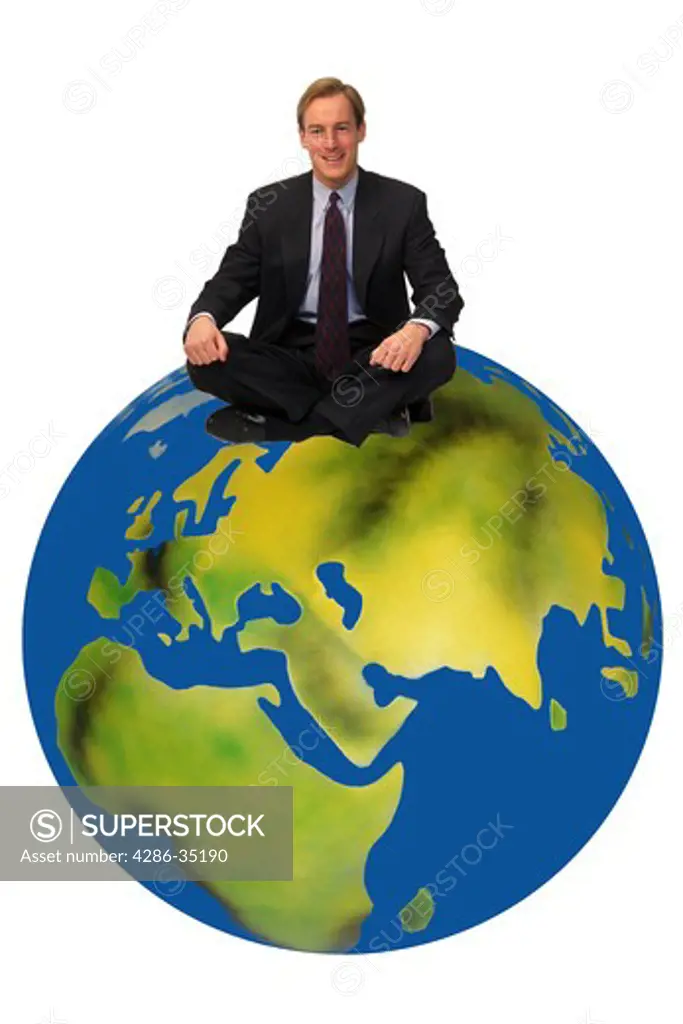 Businessman sitting on top of the world