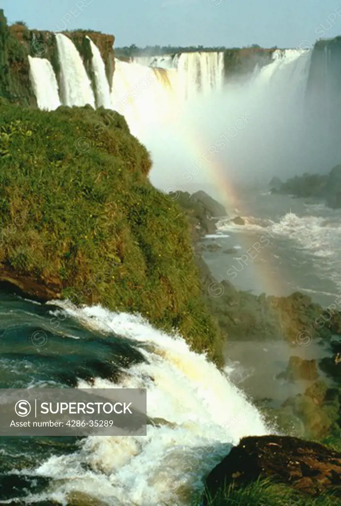Rainbow over the Iguaco Water Falls in Brazil.