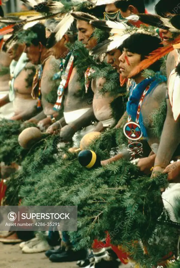 Group of male indians in traditional dress during tribal dance, San Juan Pueblo, New Mexico.