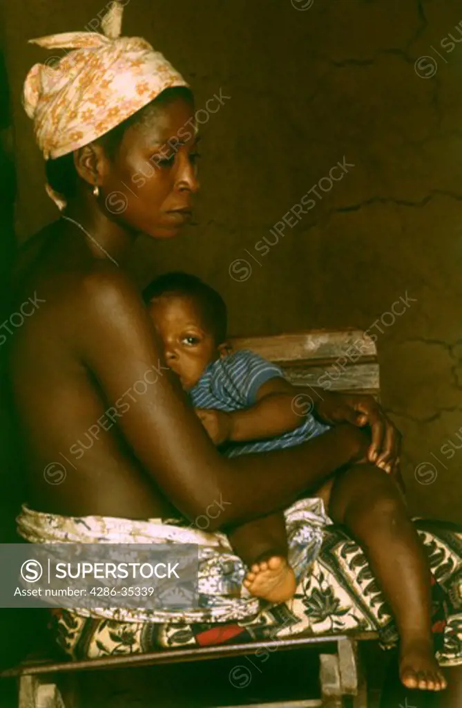 Mother nursing baby, Kpelle tribe, Liberia.