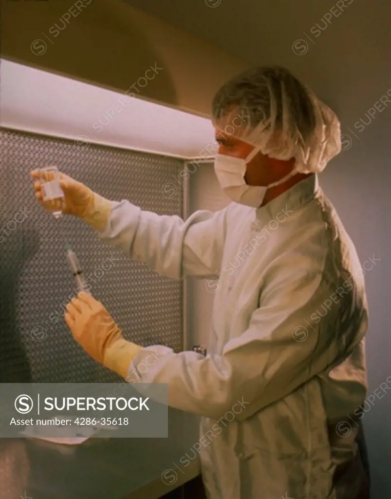 Technician with syringe, MR