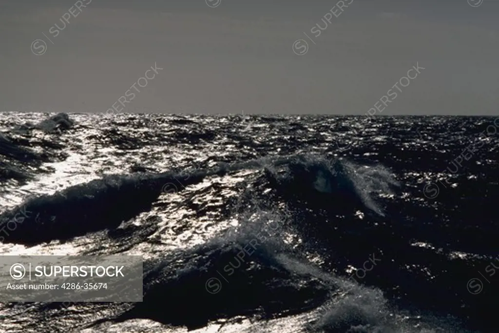 Oceanscape, with dramatic light.  Taken in the middle of the Pacific Ocean.  (Water Series.  Ocean.  Nature.)