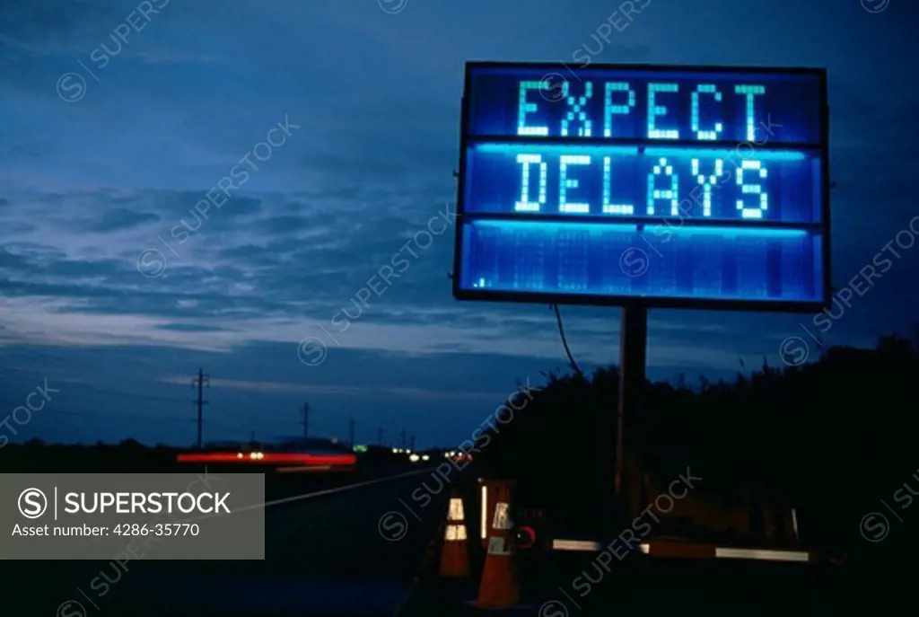 Expect Delays mobile, programmable traffic sign, at twilight. (Concept. Real Life.)