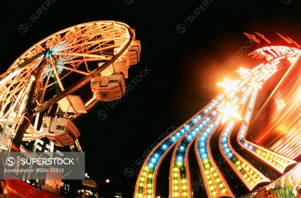 Ferris wheel and light at an amusement park.