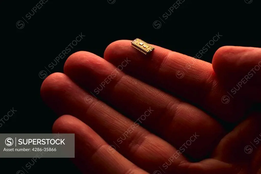 Microchip on fingertip.
