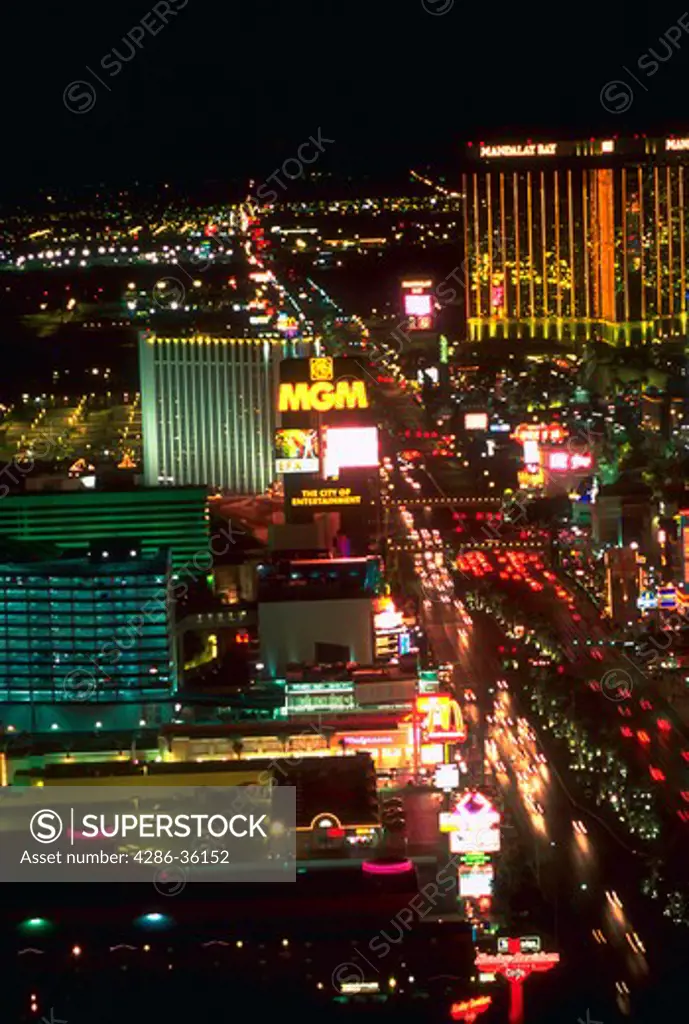 Aerial view of the Las Vegas strip with lights of hotels and casinos at night.
