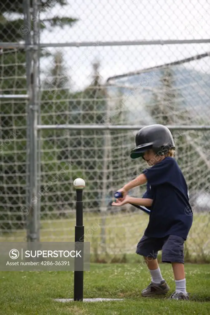 Young boy practicing T-Ball