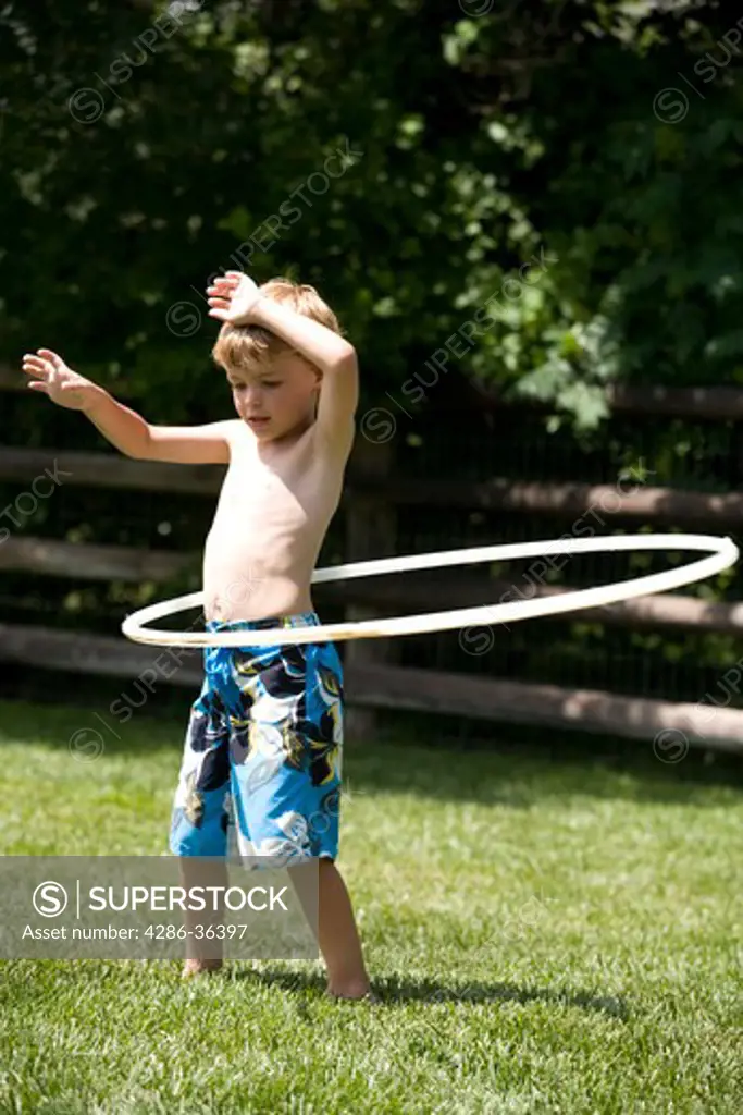 Hoola Hooping child on a sunny day