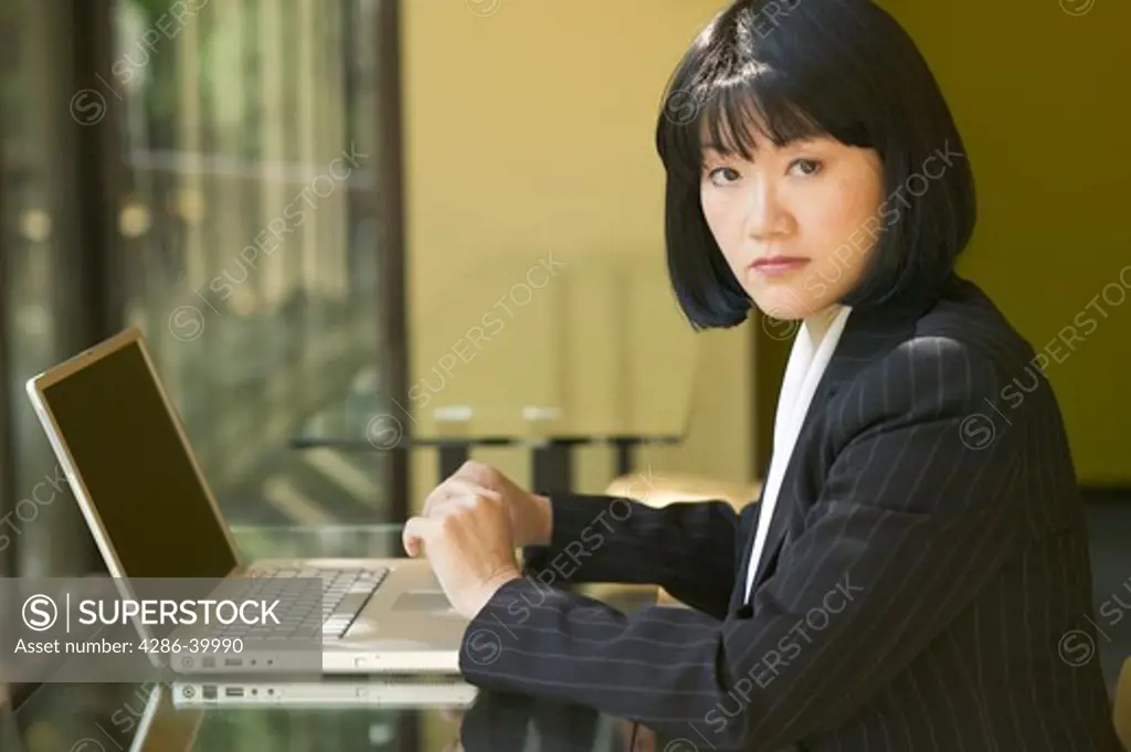 Asian business woman working on laptop  MR-0405 PR-0407