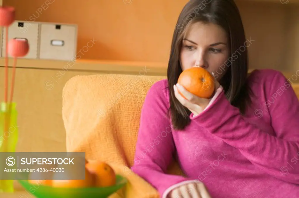 Young woman smelling orange  MR-0429 PR-0419