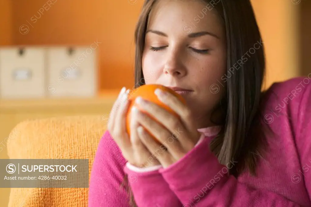 Young woman smelling orange  MR-0429 PR-0419