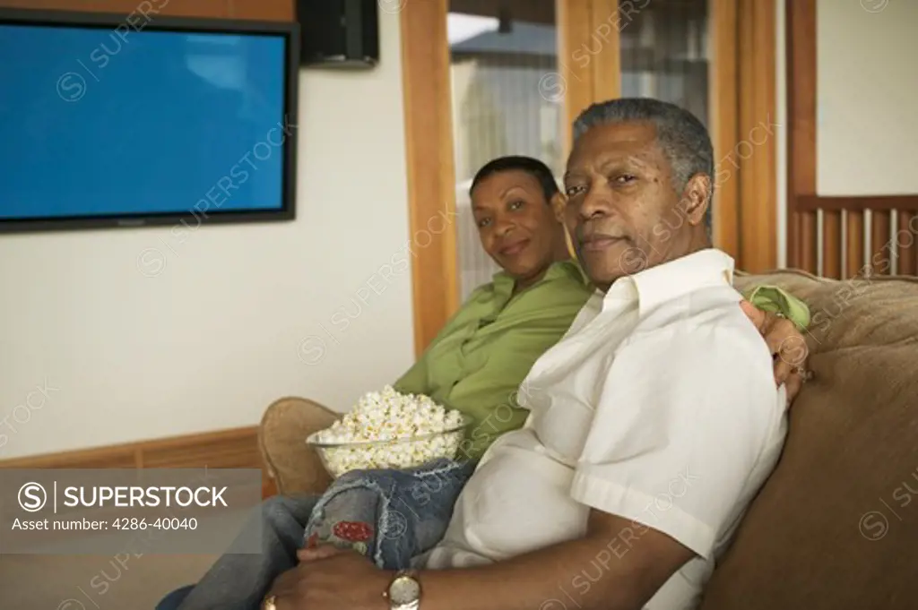 Seniors, African Americans. Watching plasma TV  MR-0509 MR-0510 PR-0505