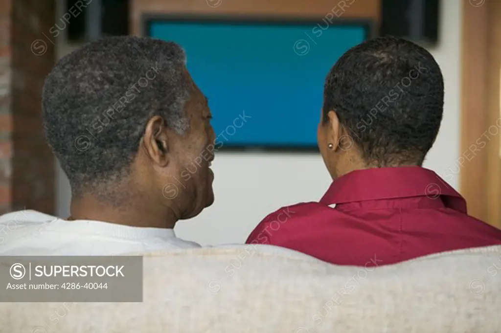 Seniors, African Americans. Watching plasma TV  MR-0509 MR-0510 PR-0505