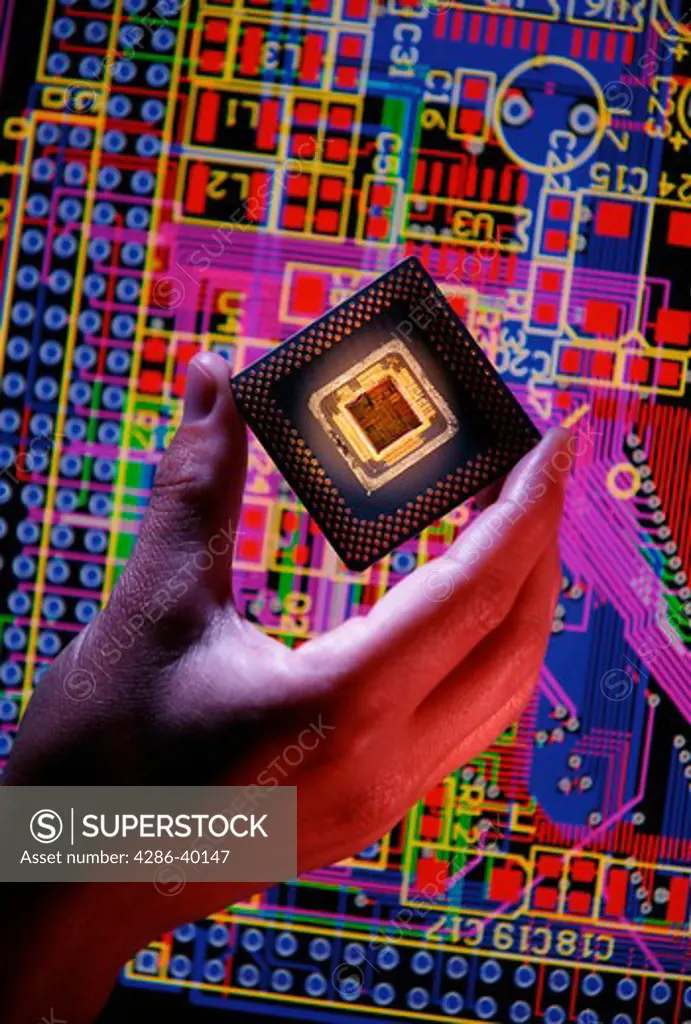 Hand Holding Computer CPU with PCB Design Background  -
