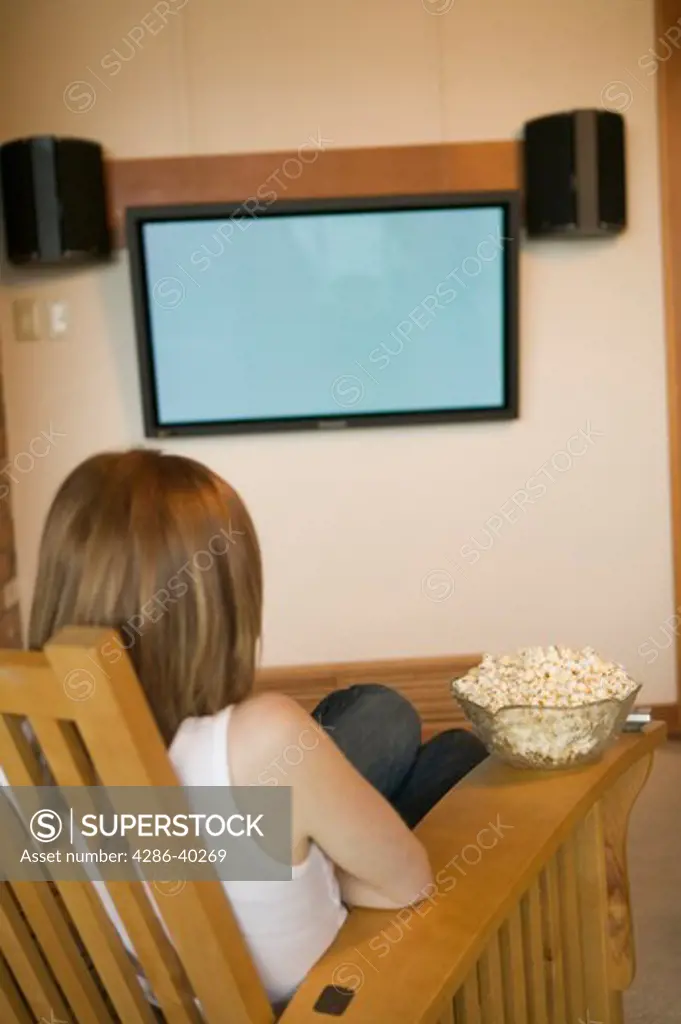 Woman watching a plasma TV  MR-0506 PR-0505