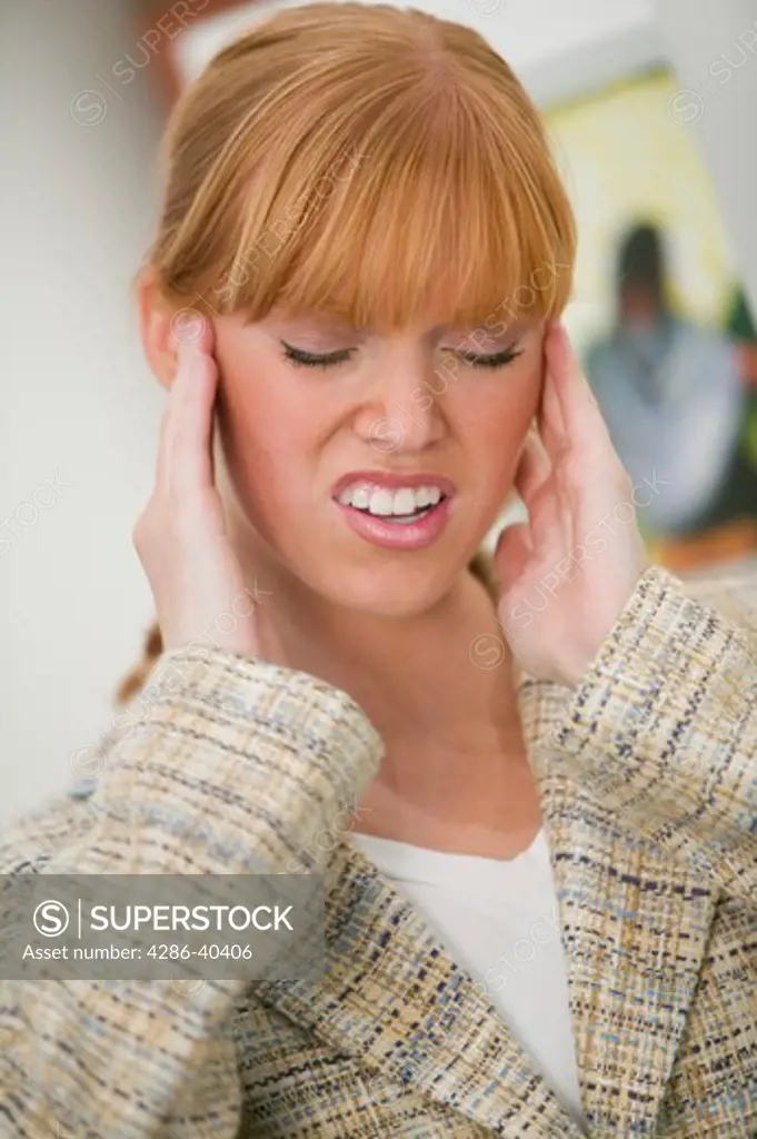 Woman with a tension headache.  MR-0439 PR-0442