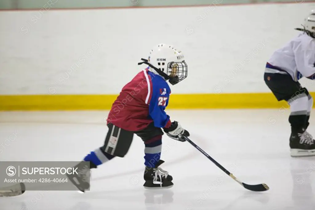 6 year old boy playing hockey.  MR-0435