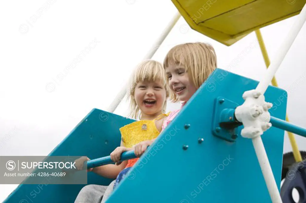 3 year old girl friends on Ferris Wheel..  MR-0501 MR-0508