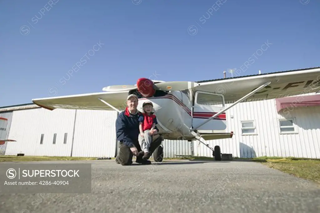 Father and 4 Year Old Daughter Posing by an Airplane, MR-0601 MR-0603 PR-0622
