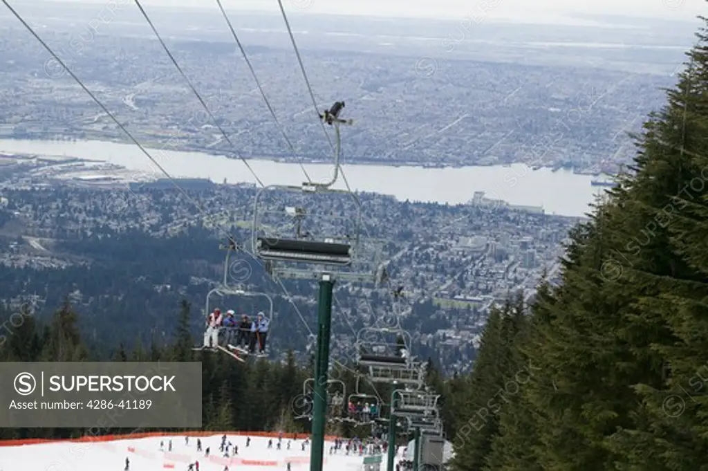 Skiers on Grouse Mountain British Columbia Canada With Vancouver in the Background