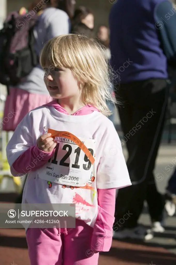 Vancouver Sun Fun Run Kids and Parents 2.5km Event. Young Participant Holding Ribbon, MR-0601