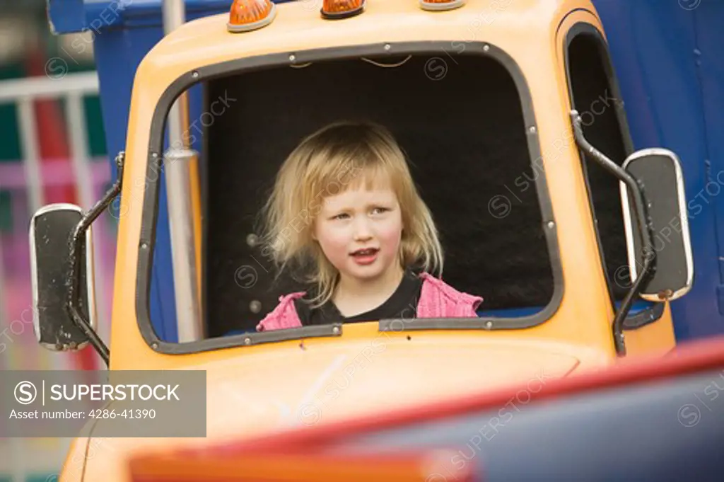Young Girl on an Amusement Park Ride