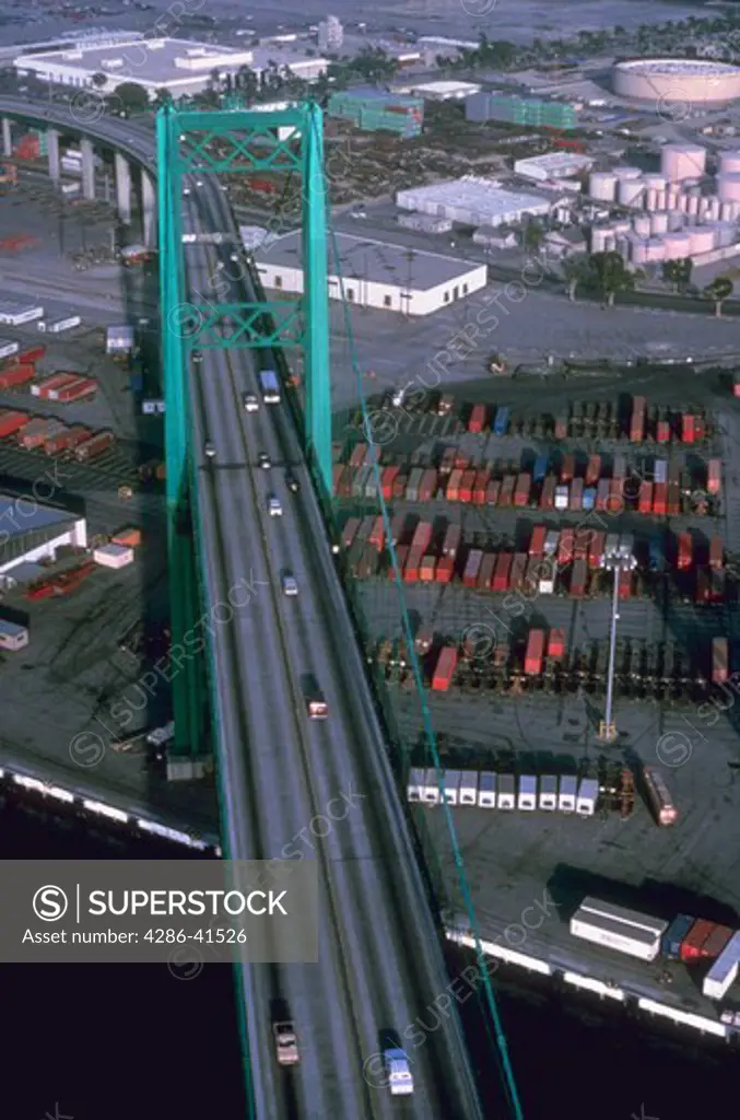 Aerial view of Vincent Thomas Bridge over shipyard in Port of Long Beach, California.