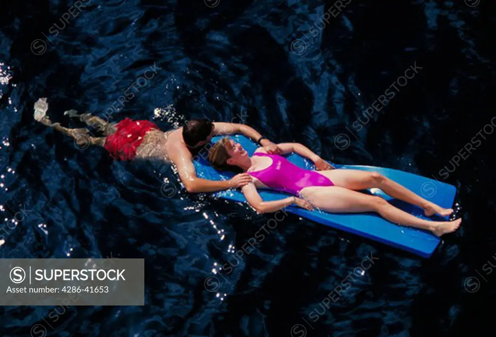 Couple on float mats