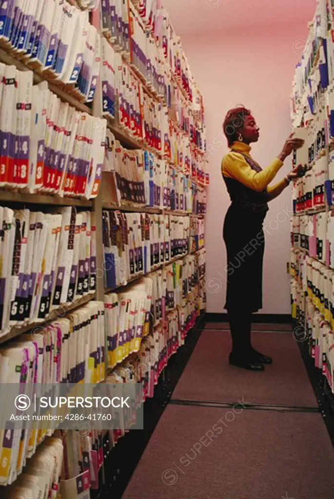black woman filing medical records, CA