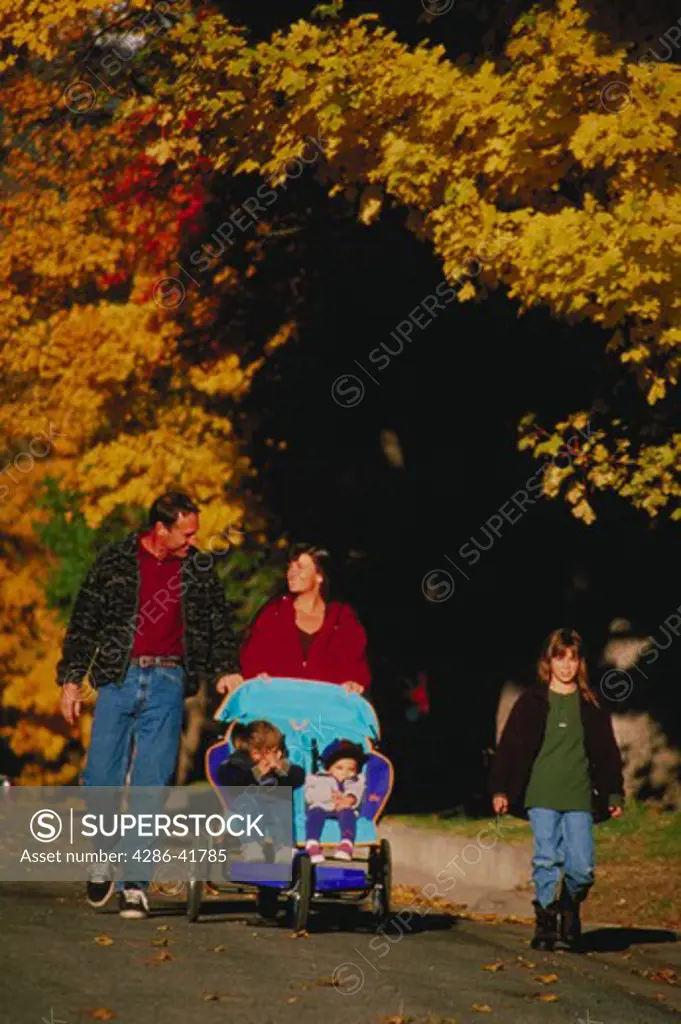 Family walk in  autumn
